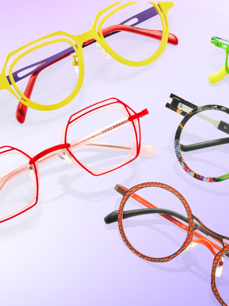Five pairs of colorful eyeglasses with bold frames in yellow, red, green, and multicolored designs are arranged on a light purple gradient background.